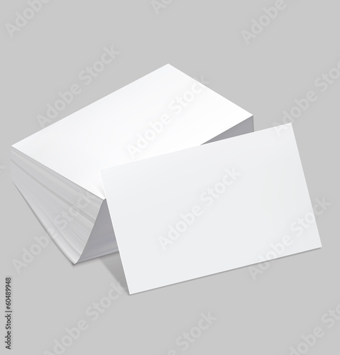 Stack of blank business card with one card in front on white bac