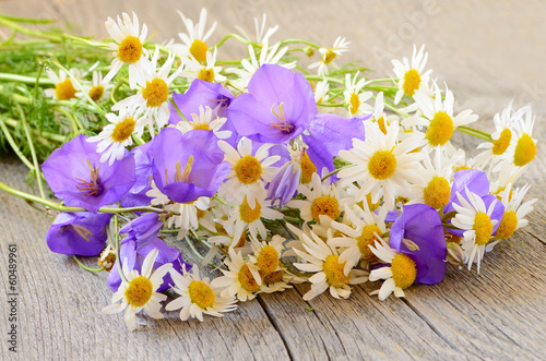 Bouquet of wild flowers on wooden table