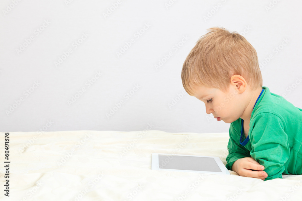 little boy with touch pad little boy with touch pad