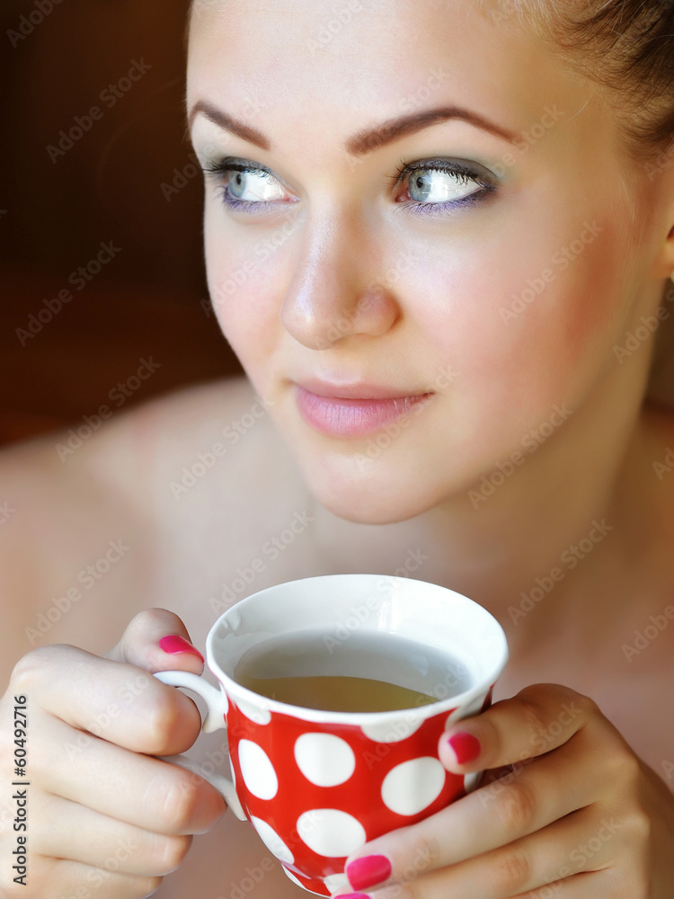 Beautiful woman holds the cup of tea Beautiful woman holds the cup of tea