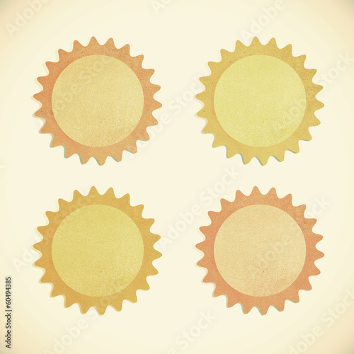 Grunge recycled paper sun on vintage tone background