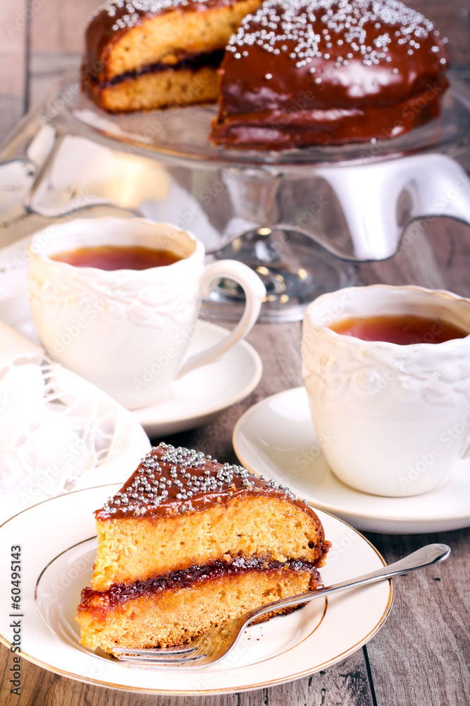 Layer spicy cake with jam and chocolate glaze Layer spicy cake with jam and chocolate glaze