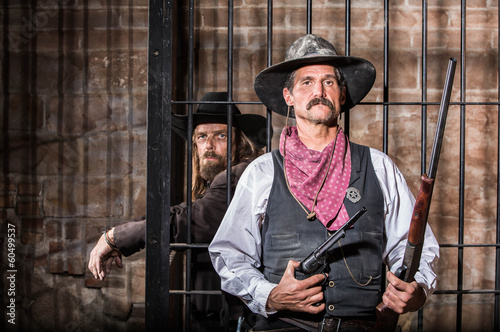 Fotografie Serious Sheriff  With Prisoner