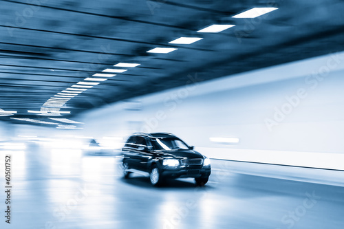 Interior of an urban tunnel with car,motion blur