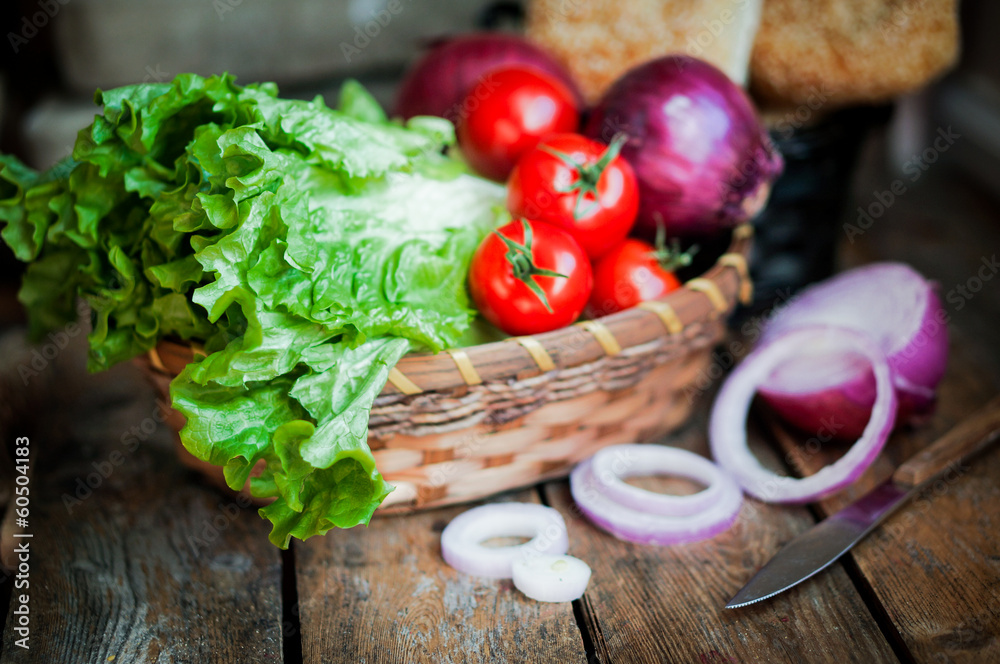 Fresh vegetables in the basket on wooden background Fresh vegetables in the basket on wooden background