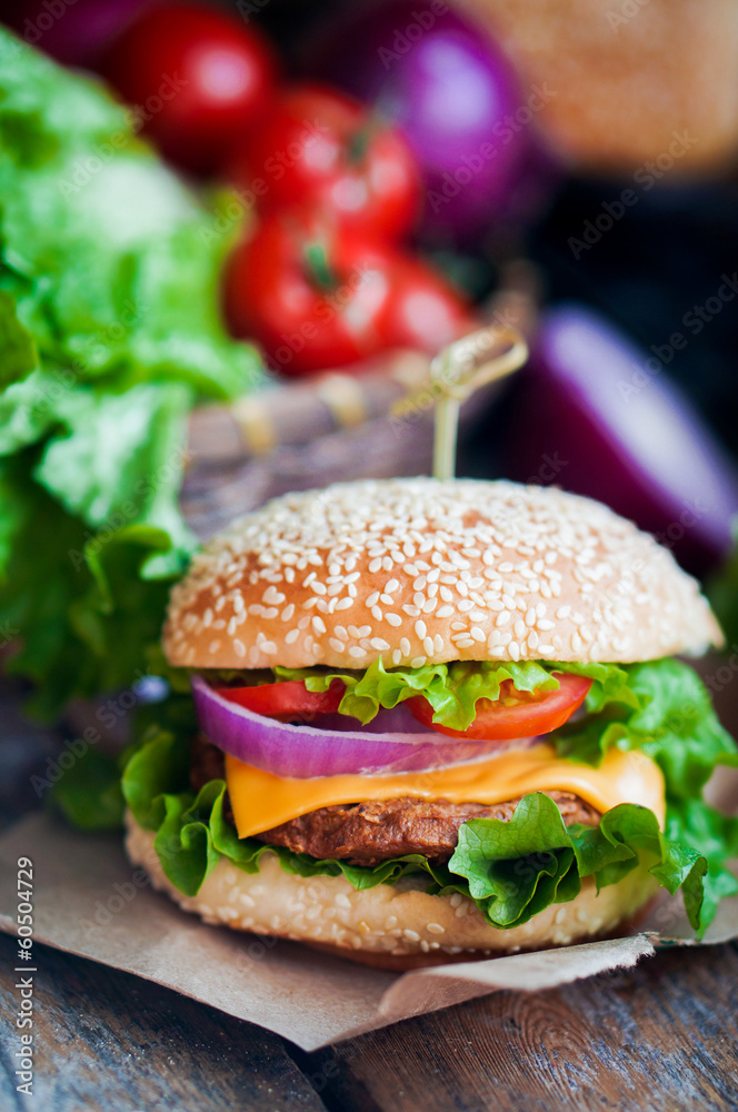 Closeup of home made burgers on wooden background