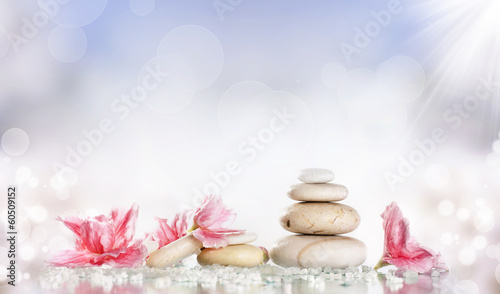 White spa stones and flower on colorful background