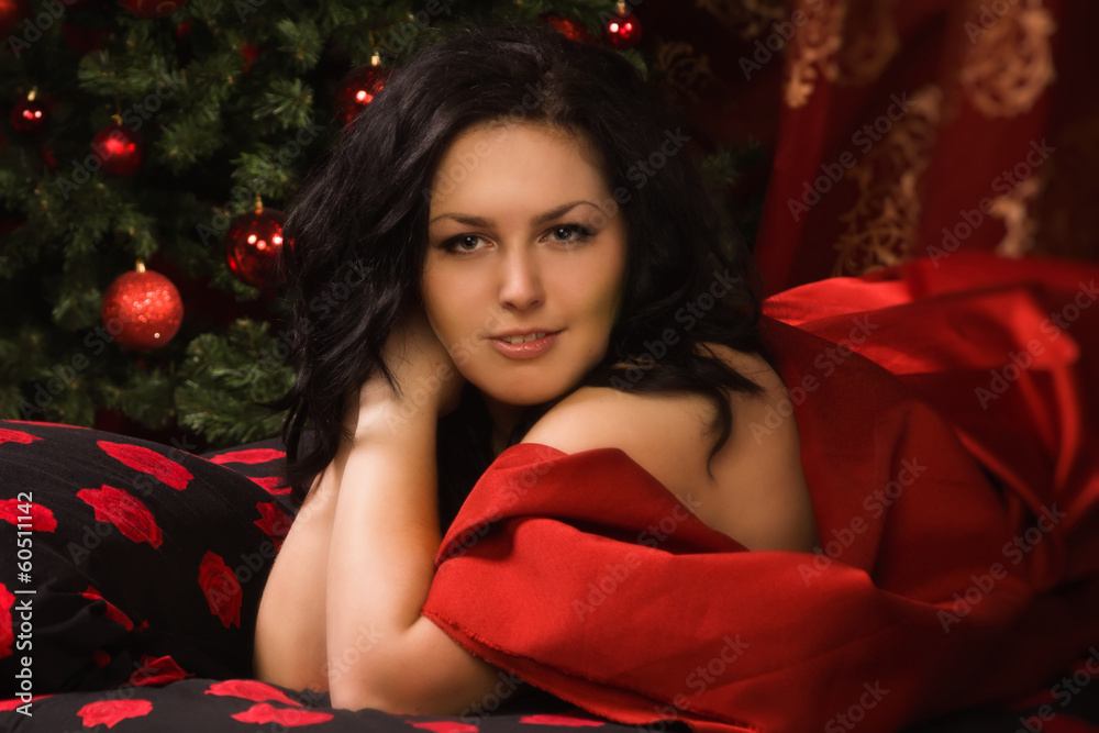 Naklejka premium sexy brunette in the bedroom