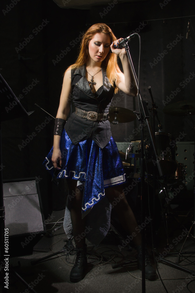 Rock star girl singing in a studio Rock star girl singing in a studio