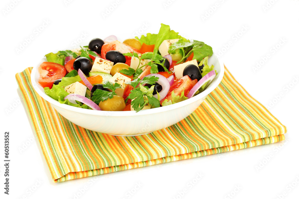 Greek salad in plate isolated on white