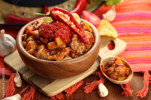 Chili Corn Carne - traditional mexican food, in wooden bowl,