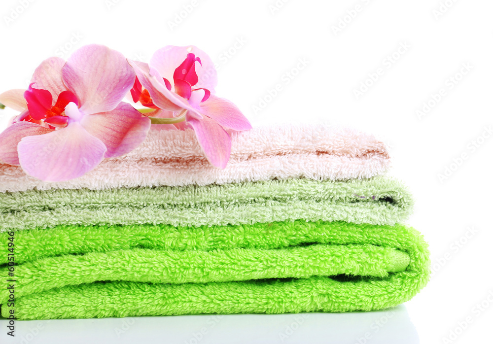 Orchid flower and towels, isolated on white Orchid flower and towels, isolated on white