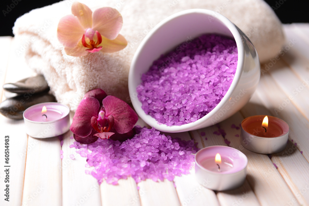 Still life with beautiful blooming orchid flower, towel and Still life with beautiful blooming orchid flower, towel and