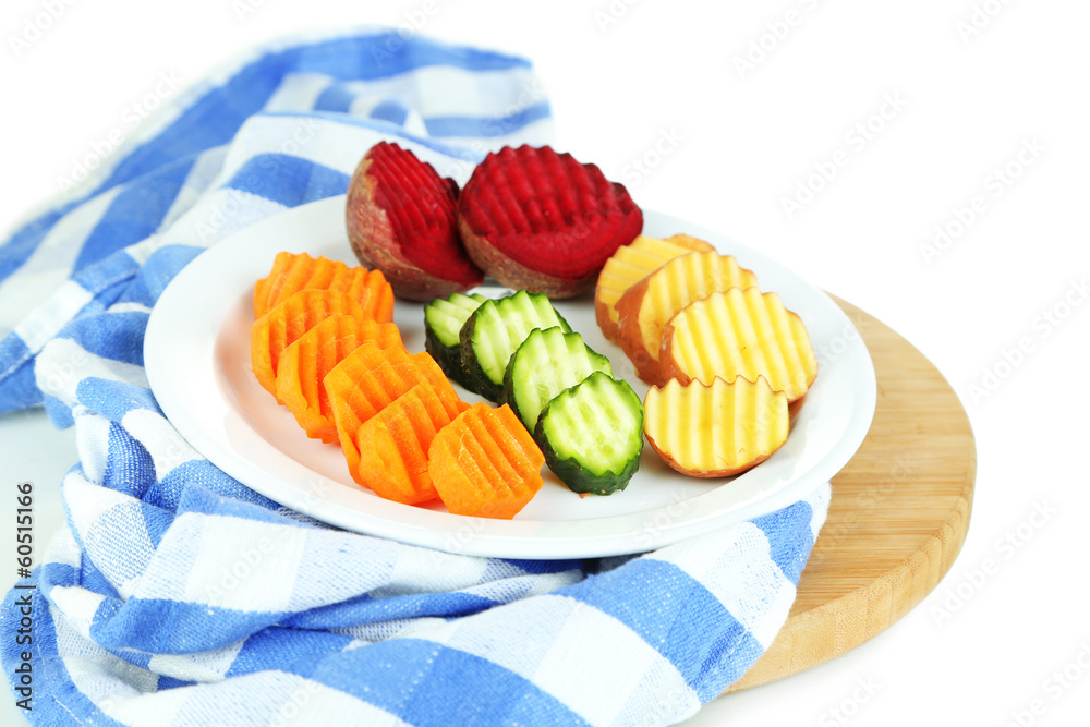 Beautiful sliced vegetables, on cutting board, isolated on