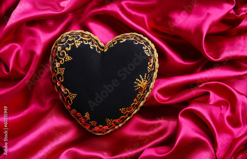 Decorative black heart  on color fabric