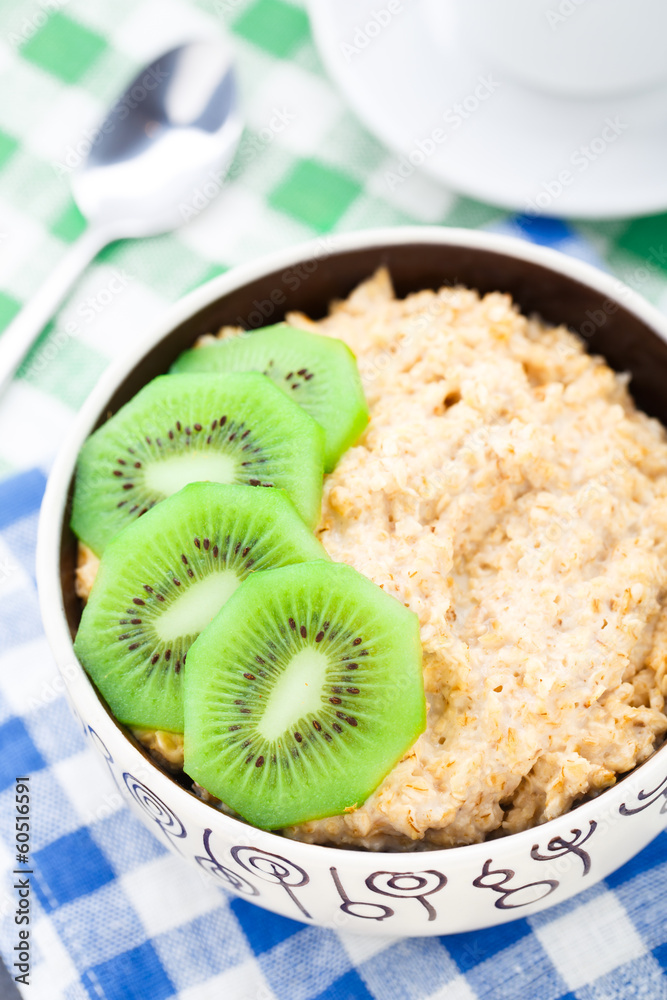 Bowl of oats porridge with kiwi Bowl of oats porridge with kiwi