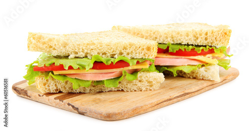 Fresh and tasty sandwiches on cutting board isolated on white