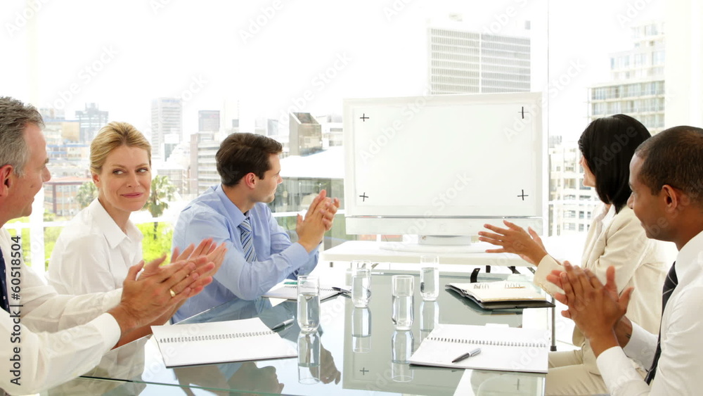 Business people applauding at a meeting Business people applauding at a meeting