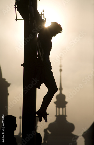 Obraz na plátne Prague - cross on the charles bridge - silhouette