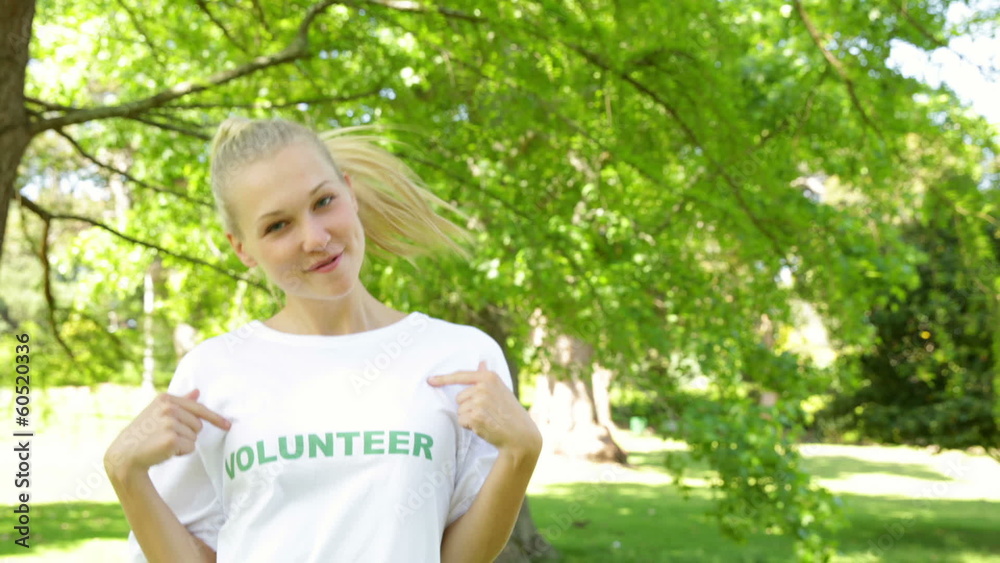 Pretty blonde volunteer dancing and smiling at the camera Pretty blonde volunteer dancing and smiling at the camera