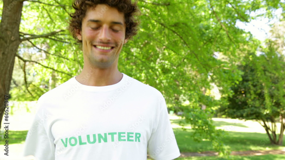 Handsome volunteer smiling at the camera Handsome volunteer smiling at the camera