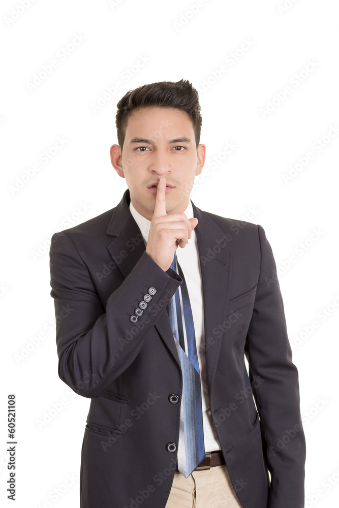 hispanic businessman putting fingers on lips, shh hispanic businessman putting fingers on lips, shh