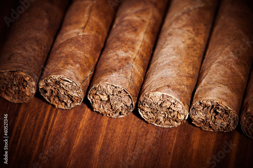 cigars on wooden background photo