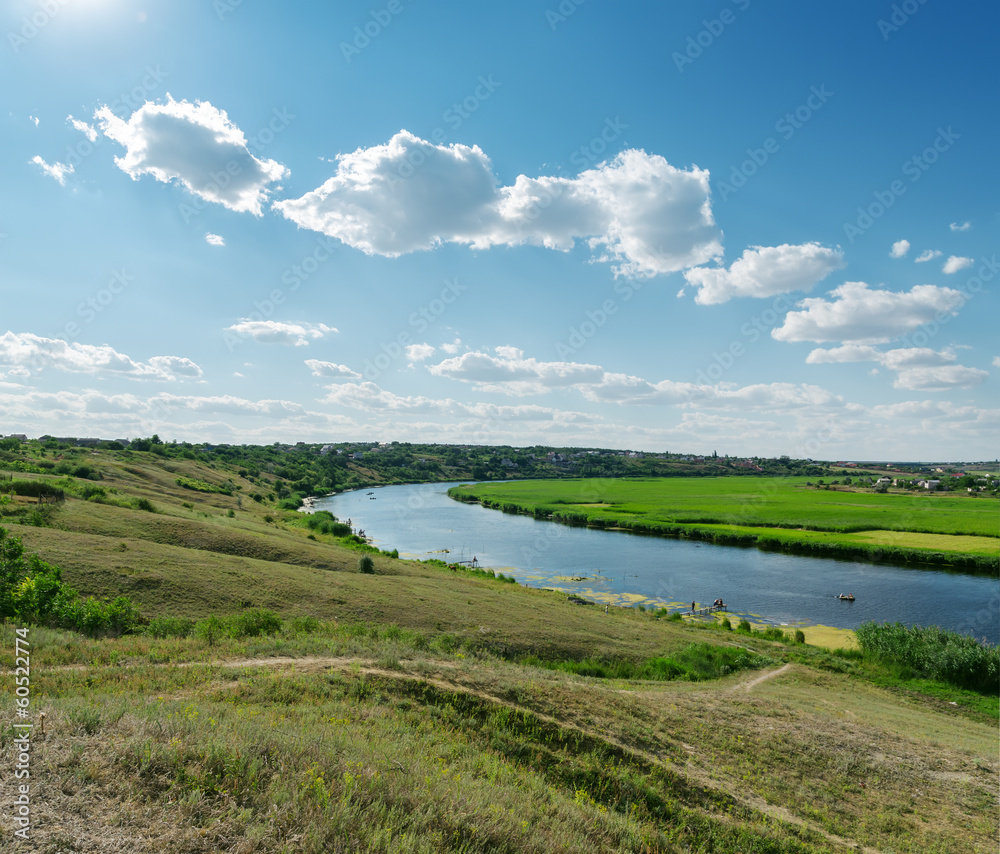 Obraz premium blue sky with clouds over river