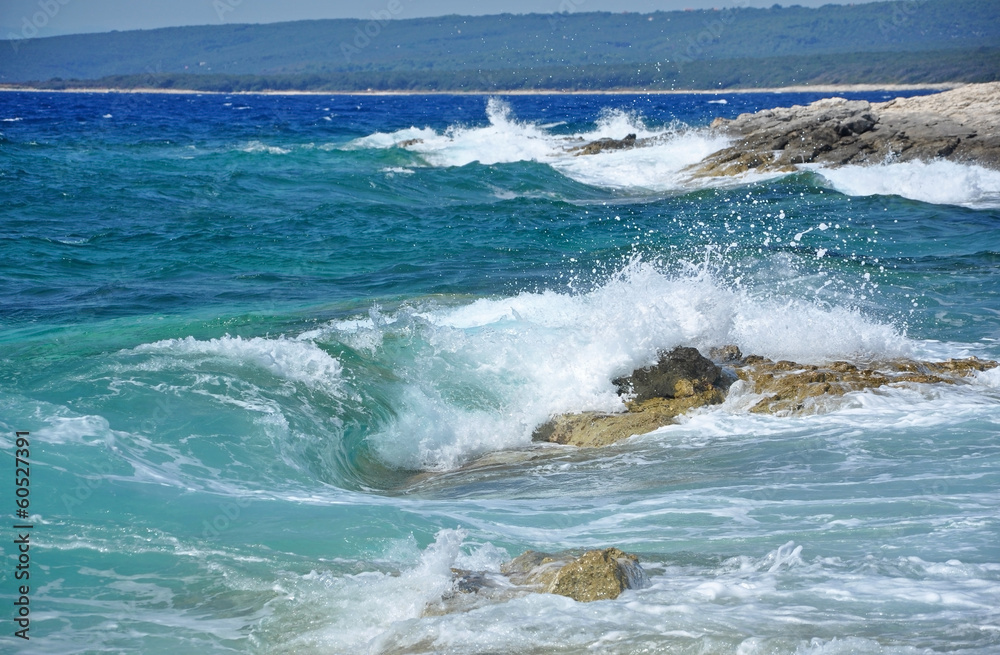 Powerful waves crushing on a rocky coastline