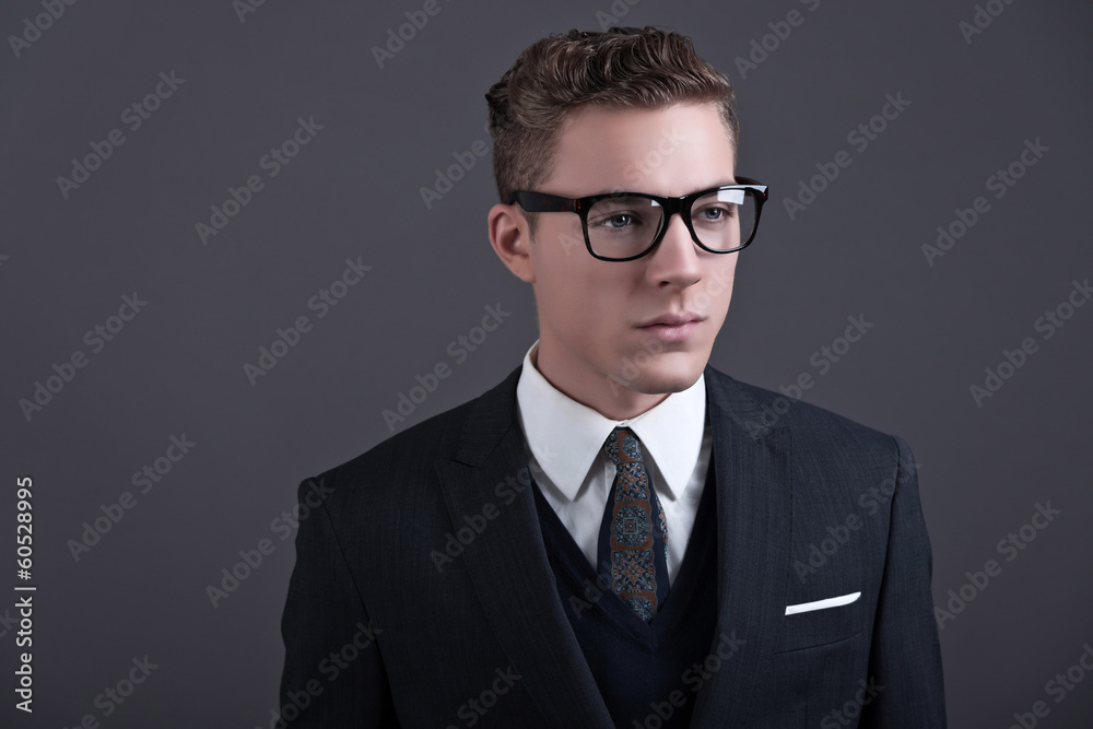 Retro fifties fashion young businessman with black glasses weari Retro fifties fashion young businessman with black glasses weari