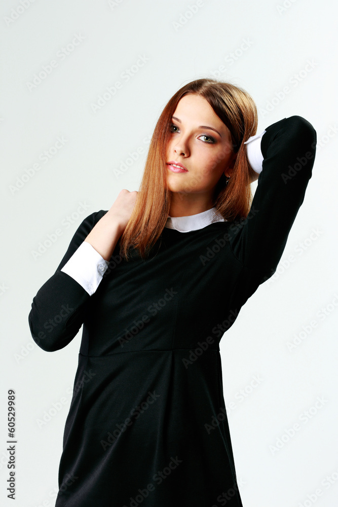 Portrait of a young beautiful woman on gray background Portrait of a young beautiful woman on gray background