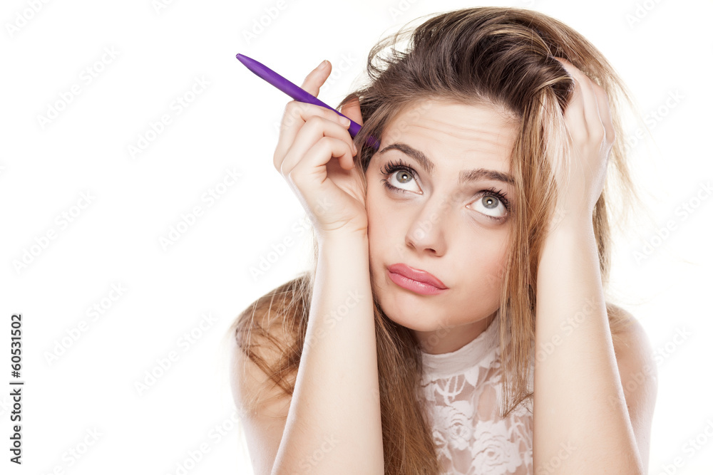 thoughtful girl with a pen and questionable gesture thoughtful girl with a pen and questionable gesture