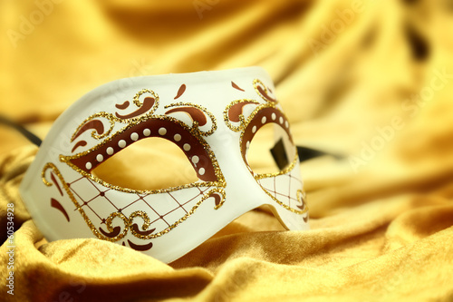 Vintage venetian carnival mask on velvet background