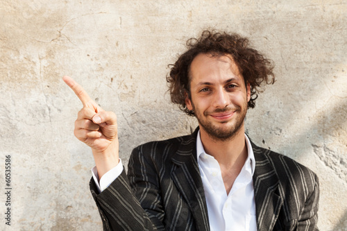 portrait of cheerful young man, wall background photo