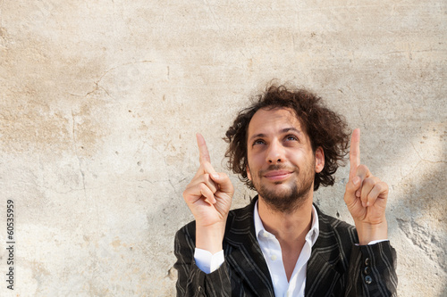 portrait of cheerful young man, wall background photo