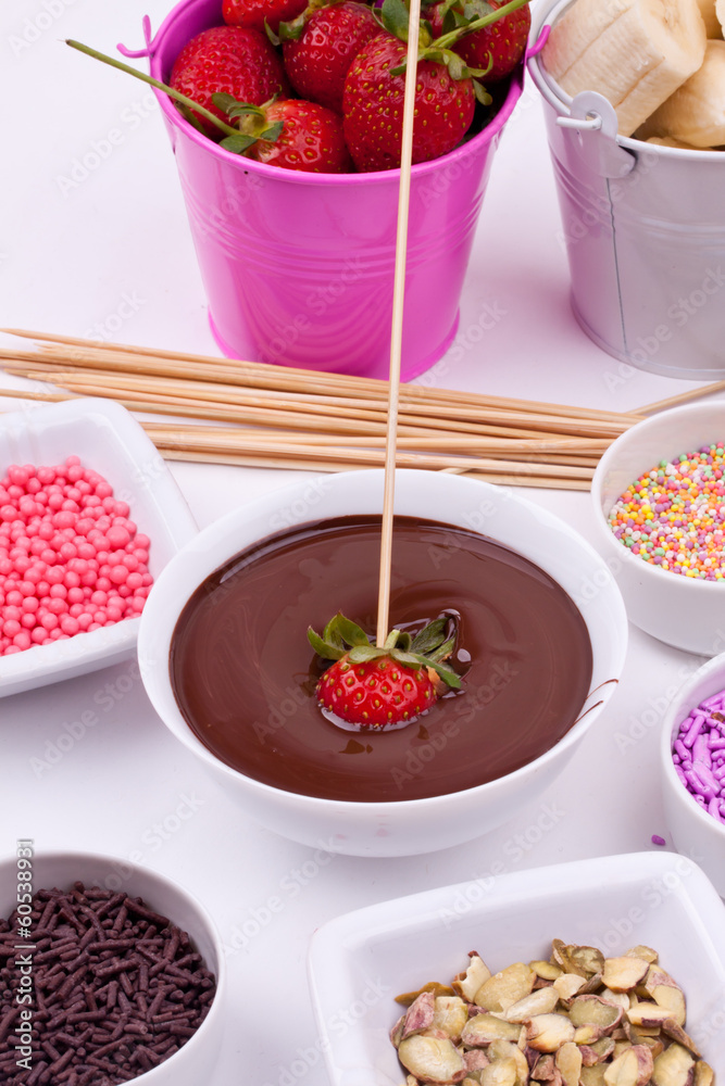 chocolate fondue with strawberry and bananan chocolate fondue with strawberry and bananan