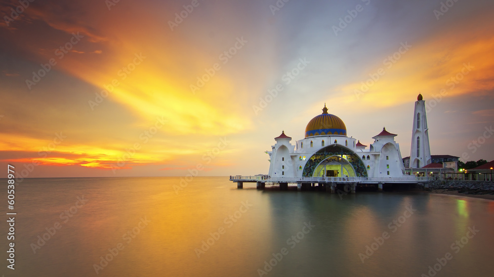 majestic floating mosque during sunset