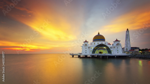 majestic floating mosque during sunset