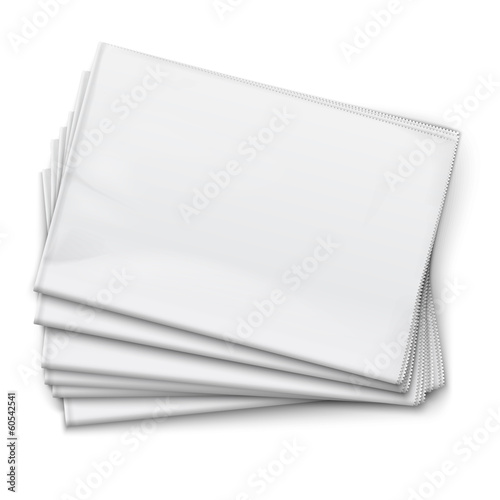 Blank newspapers pile on white background.