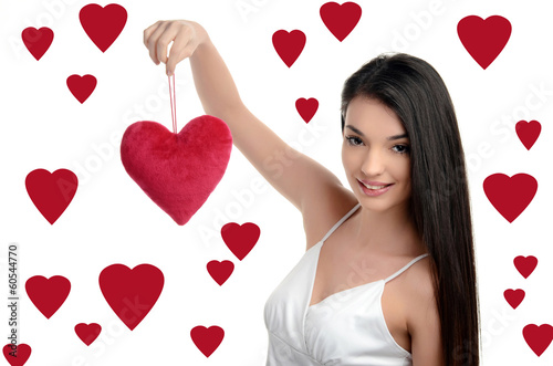 Girl holding up a red heart.Valentine day. Hearts background.