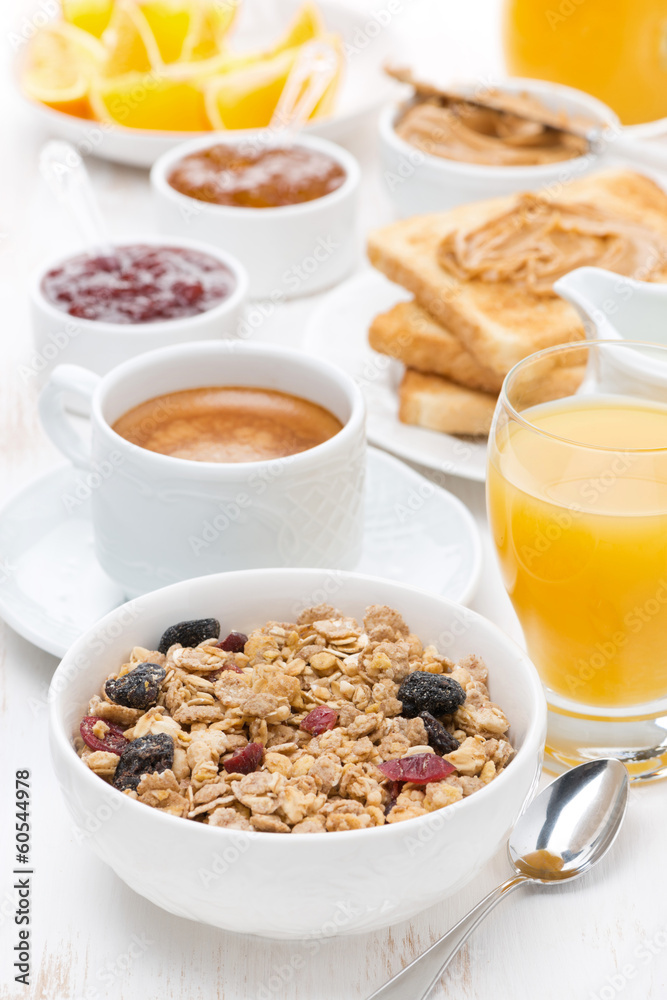 muesli, coffee, jams, toast, orange juice and peanut butter muesli, coffee, jams, toast, orange juice and peanut butter