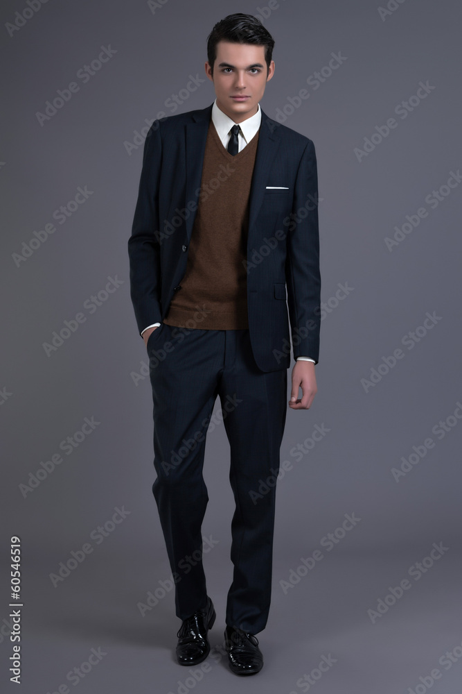 Retro 50s business fashion man with dark grease hair. Wearing da