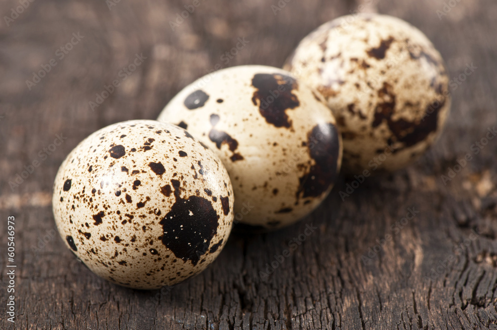 Quail eggs on a old wooden table