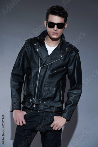 Macho retro rock and roll fifties fashion man with dark grease h