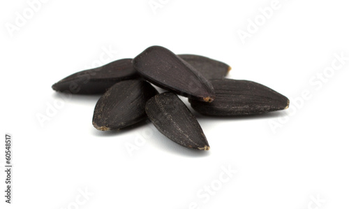 Fotografie Sunflower seeds isolated on white background