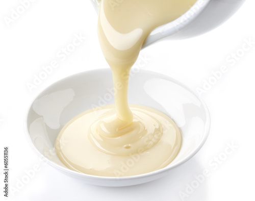 pouring condensed milk with sugar in a bowl