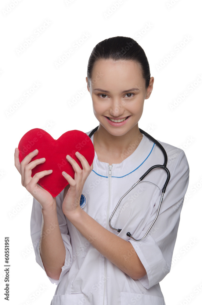 Smiling doctor holding a red heart Smiling doctor holding a red heart