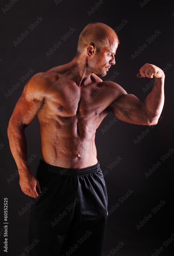 Muscular Bodybuilder Flexing Biceps Stock Photo Adobe Stock