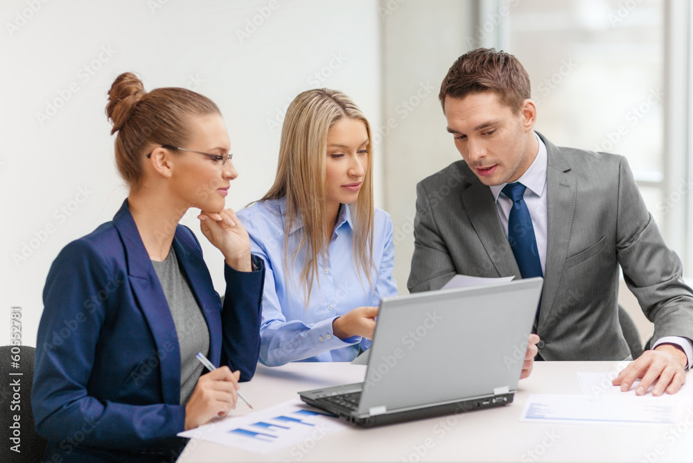 business team with laptop having discussion business team with laptop having discussion