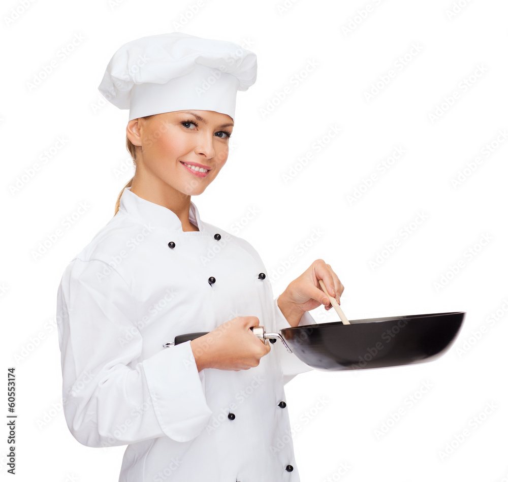 smiling female chef with pan and spoon smiling female chef with pan and spoon